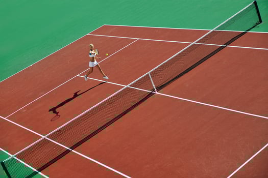 young woman play tennis outdoor photo