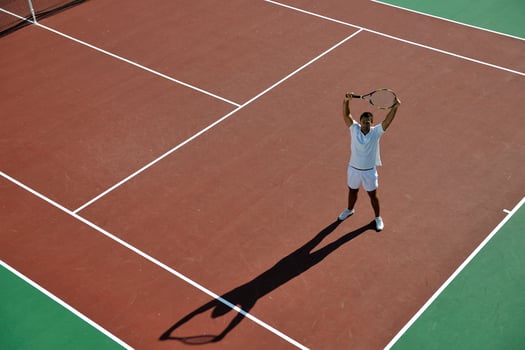 young man play tennis photo