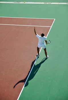 young man play tennis photo