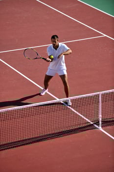 young man play tennis photo