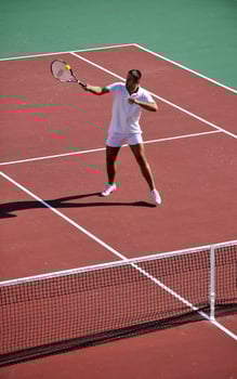 young man play tennis photo