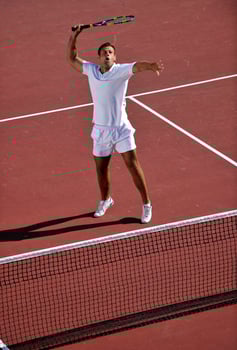 young man play tennis photo