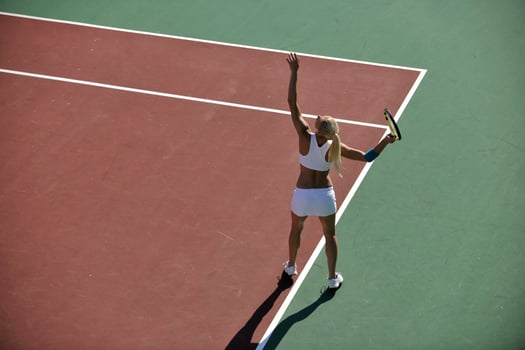 young woman play tennis outdoor photo