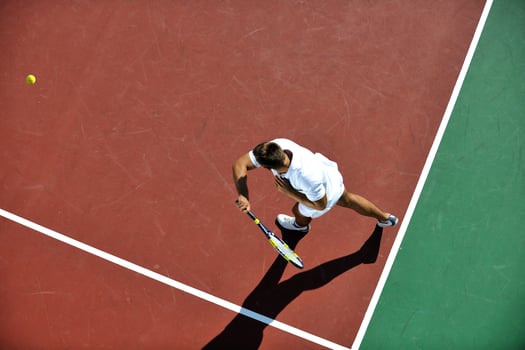 young man play tennis photo