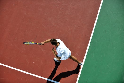 young man play tennis photo