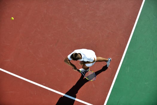 young man play tennis photo