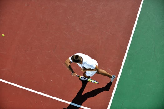 young man play tennis photo