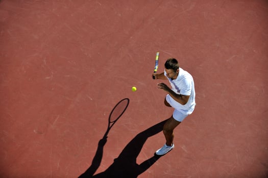 young man play tennis photo