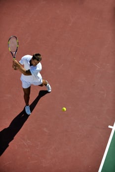 young man play tennis photo