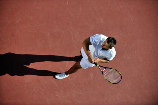 young man play tennis photo