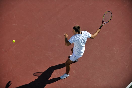 young man play tennis photo
