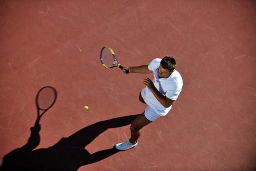 young man play tennis photo