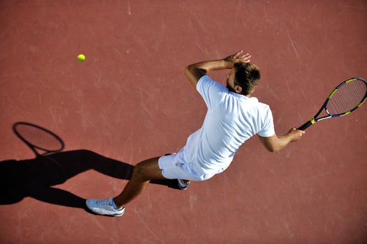 young man play tennis photo