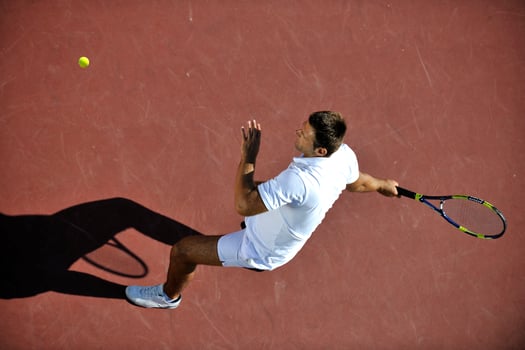 young man play tennis photo