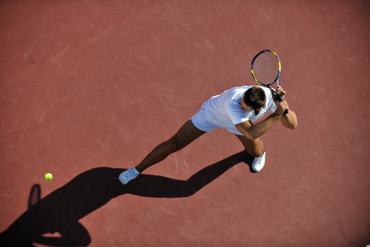 young man play tennis outdoor photo