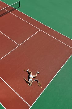 young woman play tennis outdoor photo