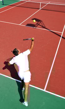 young man play tennis outdoor photo