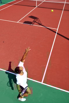 young man play tennis outdoor photo