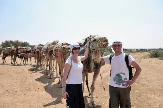 Posing with camels photo