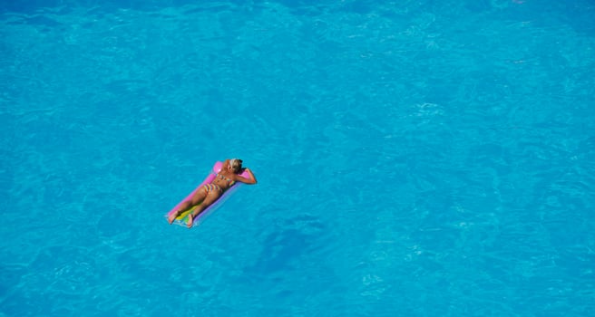 woman relax at swimming pool photo
