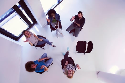 Multiethnic startup business team on meeting  top view photo