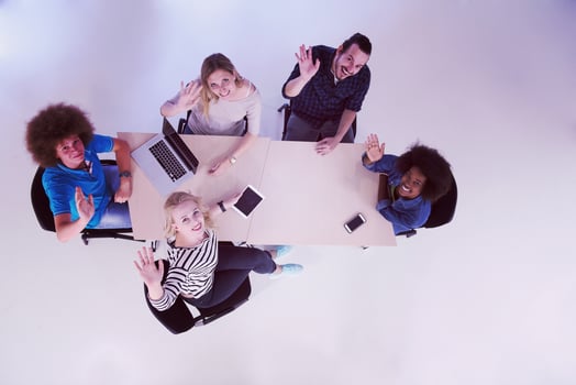 Multiethnic startup business team on meeting  top view photo
