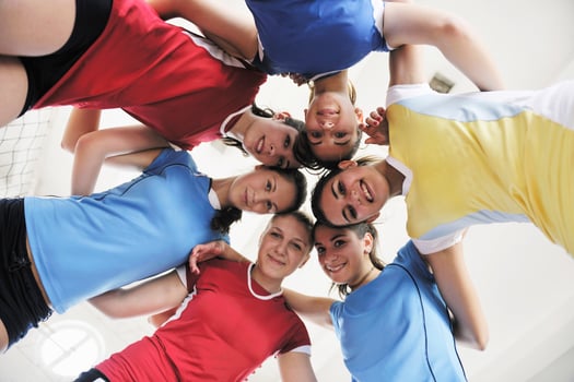 girls playing volleyball indoor game photo
