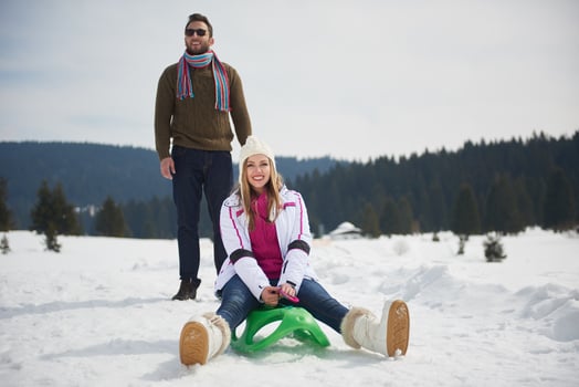 happy young couple having fun on fresh show on winter vacation photo