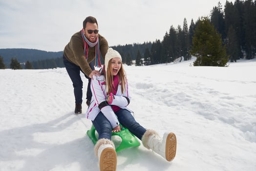 happy young couple having fun on fresh show on winter vacation photo