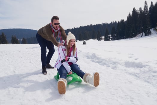 happy young couple having fun on fresh show on winter vacation photo