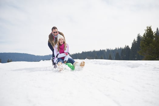 happy young couple having fun on fresh show on winter vacation photo