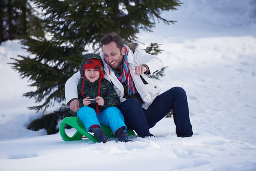 couple having fun and walking in snow shoes photo