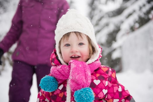 little girl have fun at snowy winter day photo
