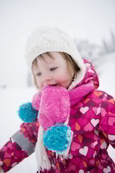 little girl have fun at snowy winter day photo