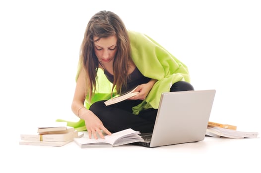 one young girl work on laptop isolated on white photo