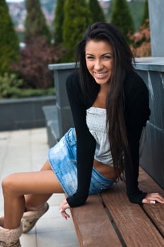 beautiful young lady posing in garden photo