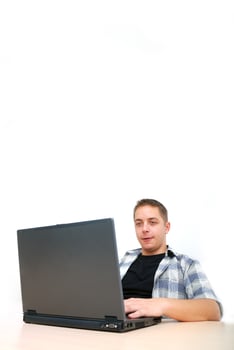 young man working on laptop photo