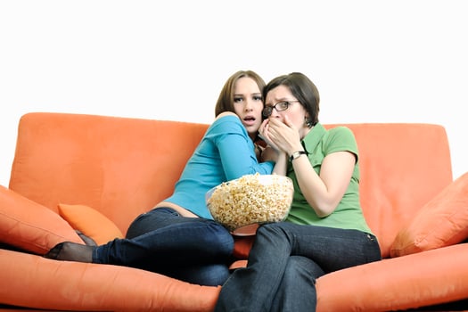 two woman watching television photo