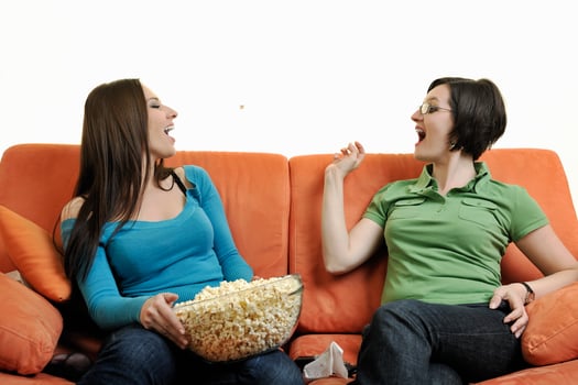 two woman watching television photo