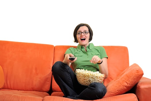 young woman eat popcorn and watching tv photo