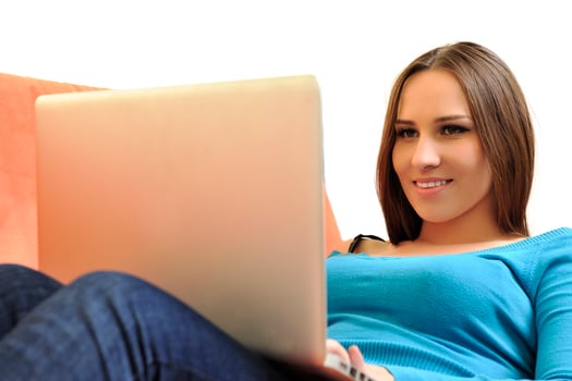 woman using a laptop computer at home photo