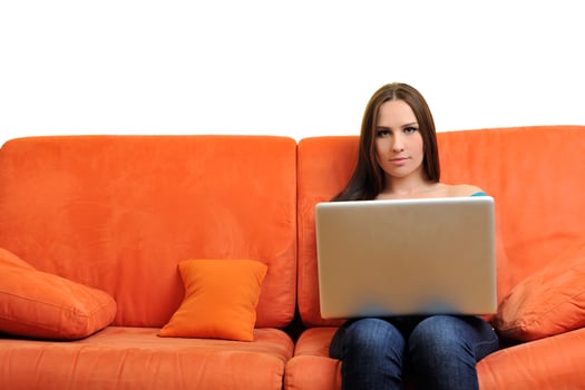 woman using a laptop computer at home photo