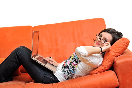 woman using a laptop computer at home photo