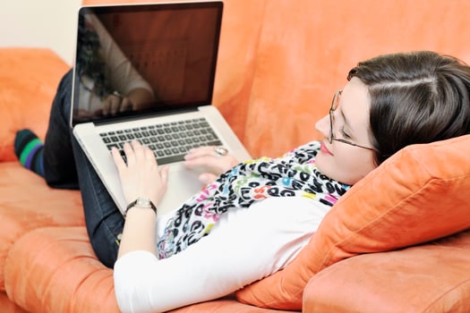 one young woman working on laptop photo