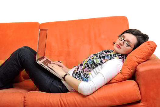 woman using a laptop computer at home photo