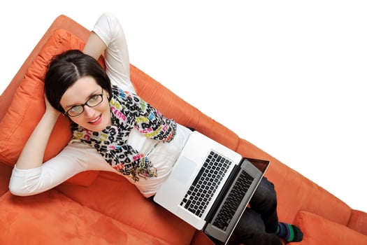 woman using a laptop computer at home photo