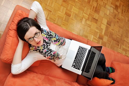 woman using a laptop computer at home photo