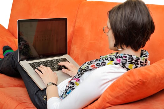 woman using a laptop computer at home photo