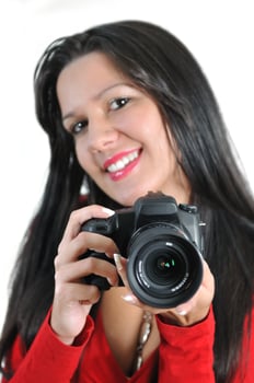 Young woman holding camera in hand taking picture isolated photo