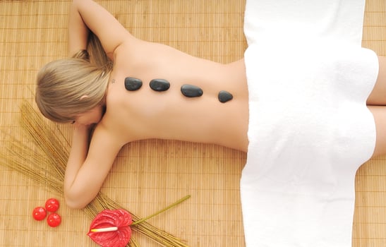 Massage with hot volcanic stones photo